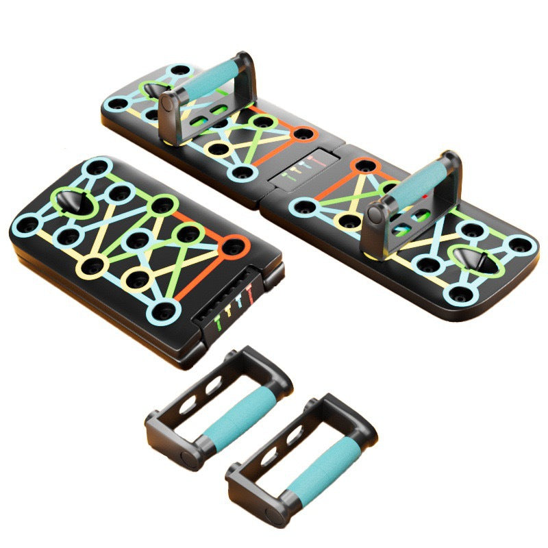 A foldable push-up board shown in two positions on a white surface, with colorful printed exercise path graphics across the metal surface. 